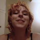 An American, blonde girl places her camera underneath an acrylic panel to give us a great view of the shit coming out of her ass - just like those 1970s under the glass coffee table shots! She mashes the shit with her ass. Over 1.5 minutes.